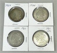 Four 1921 Morgan Silver Dollars.