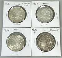 Four 1921 Morgan Silver Dollars.