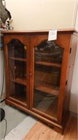 Wood cabinet with glass front doors