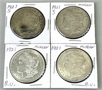 Four 1921 Morgan Silver Dollars.