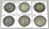 Six Morgan Silver Dollars.