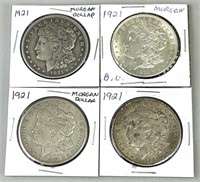 Four 1921 Morgan Silver Dollars.