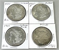 Four 1921 Morgan Silver Dollars.