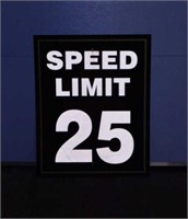 Retired metal Purdue University speed limit road