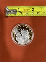 Appears to be American Mint Liberty Medium coin