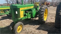 John Deere 720 diesel tractor with a good tires,