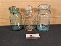 Baled quart jars (1 green, 1 clear/amber, 1 blue)