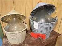 2 Plastic Wicker styled baskets with glass jugs