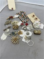 Pile of costume jeweler, ear rings, broaches
