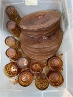 Box with amber glass, plates, glasses and cups