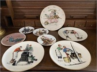 7 Norman Rockwell Plates & 1 Clock Plate