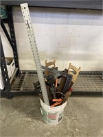 Bucket of tools hand saws and more