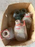 Antique milk bottles, jars