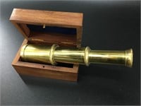 Brass telescoping spyglass in a mahogany box. The