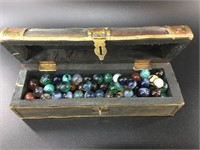 Decorative treasure chest full of vintage marbles.