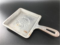 Cast iron square skillet with a sunflower stamp, t