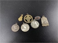 Collection of Catholic pins and medals including a
