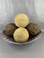 A Woven Basket With 5 Natural Orbs