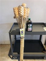 6 tiki torch stands and jug of bite fighter