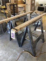 Pair folding saw horses with 2x4 attached to tops