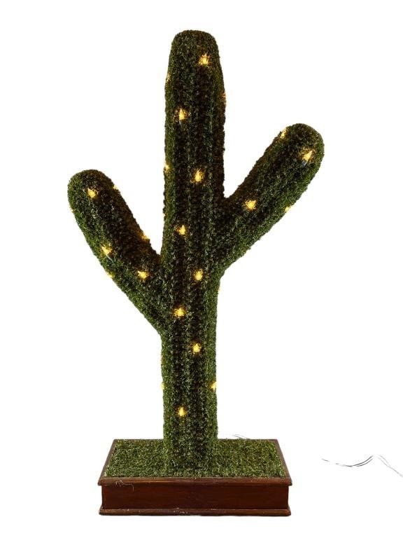 A Turf Light Up Cactus On Wood Stand