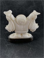 Vintage ivory carving of a successful fisherman on