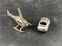 2 Poured silver figurines including a helicopter a