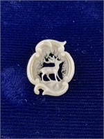 Small bone pendant with traditional stag carvings