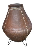 A Large Pottery Vase w/ Rawhide Accents On Stand