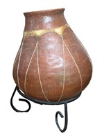 A Large Pottery Vase w/ Rawhide Accents On Metal