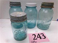 4 BLUE GLASS JARS WITH LIDS