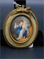 Oval painting on porcelain, young girl sewing,