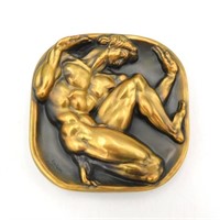 A gilded bronze medal by Donald Delue. Titled
