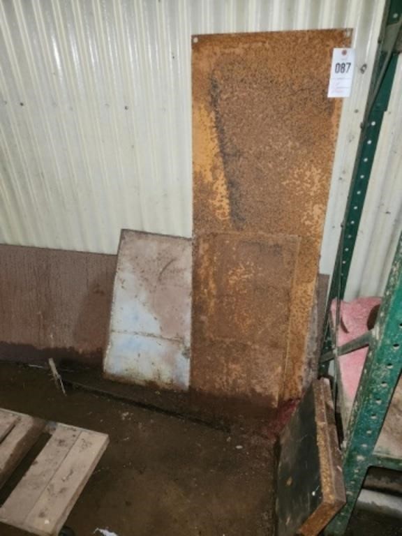 LOT METAL PLATES AGAINST WALL