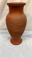 Terra-cotta vase with raised dragon art