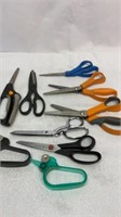 Two pinking shears and other sewing scissors