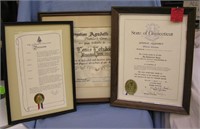 Three framed awards and proclamations