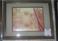 Matted and framed photo of a stream and wood scene