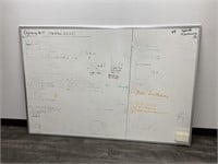 Dry erase board. 72in wide x 48in tall.