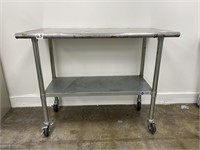 NSF Stainless steel work table on casters.