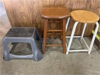 Two Wooden Stools and One Plastic Stool