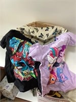 basket with two kids shirts new