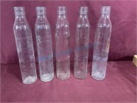 Five shell oil bottles