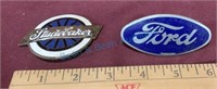 Antique Ford and Studebaker car badges