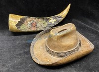 Cowboy hat, bank, and plaster horn carving