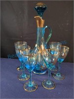 Blue and gold decanter and wine glasses