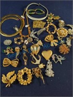 Brooches pins and necklaces