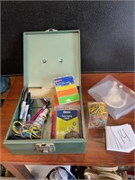 yard sale cash box with office supplies
