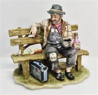 PUCCI CAPODIMONTE STYLE OLD MAN ON BENCH FIGURINE