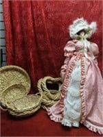 Large porcelain doll, woven baskets.
